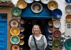 Essaouira.  Sally outside plate shop.
